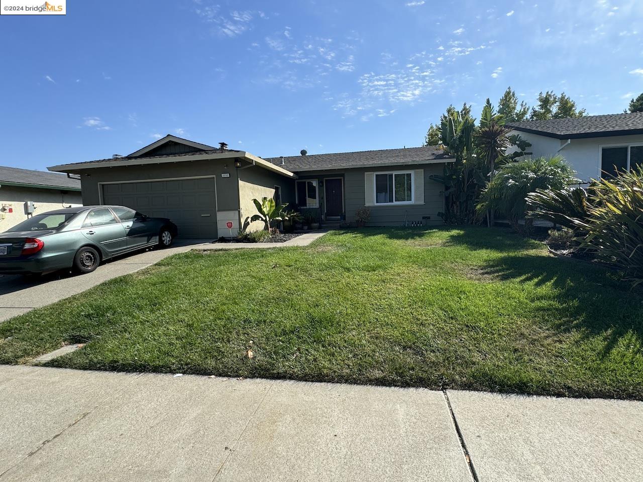 a view of a car in front of a house