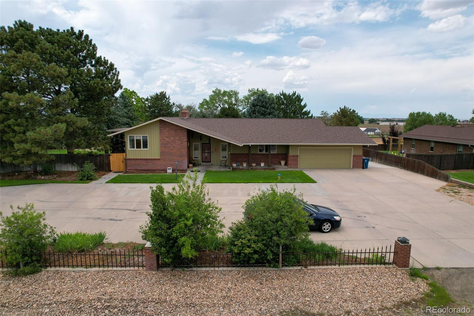 a aerial view of a house with a yard