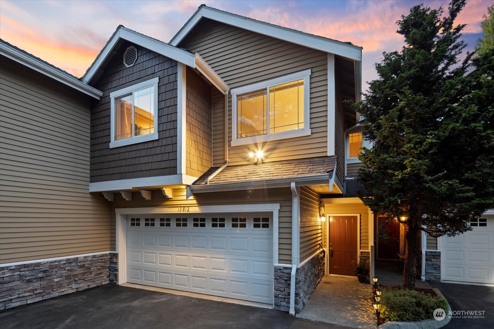 a front view of a house with a garage