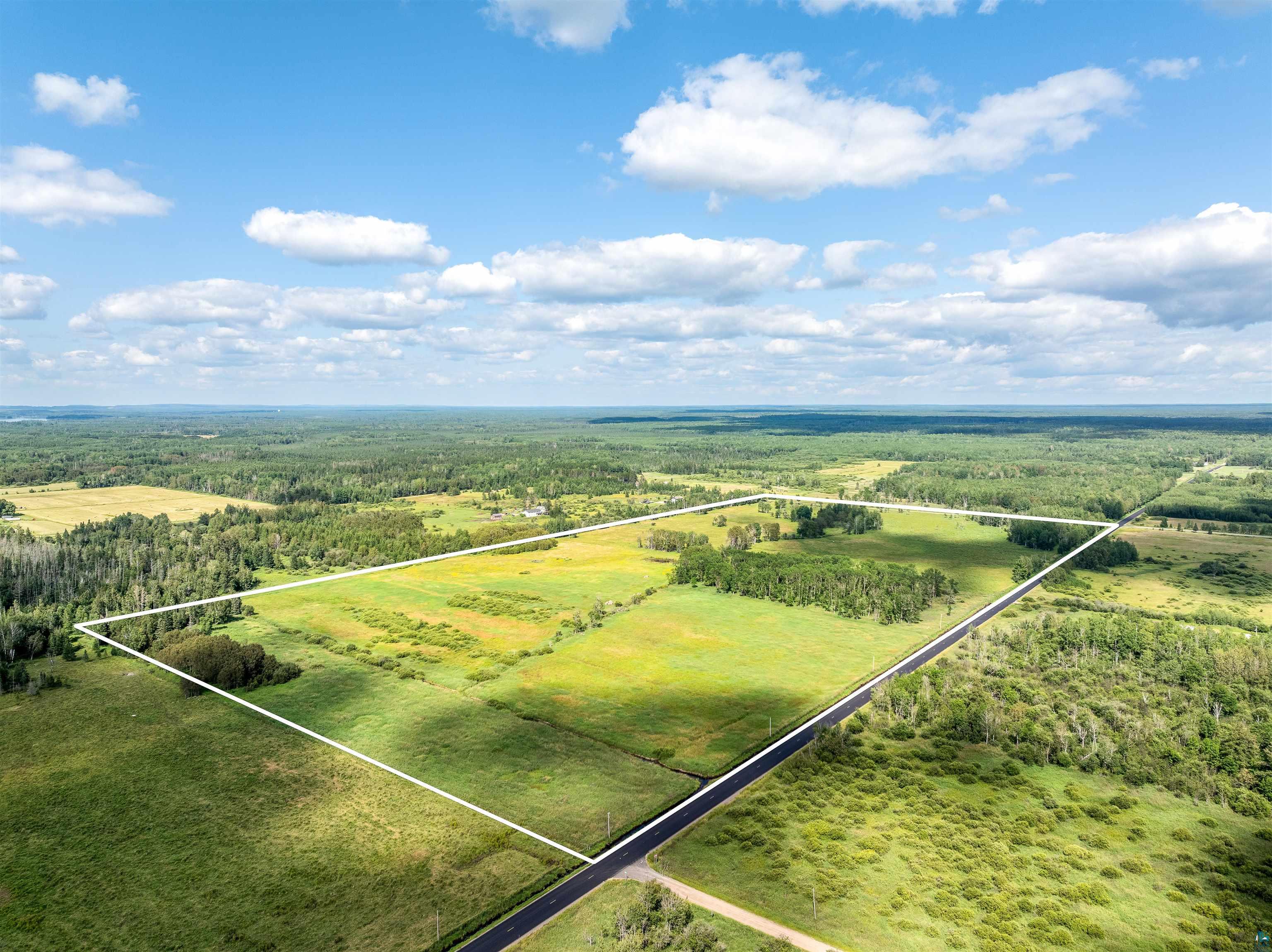 Birds eye view of property with a rural view