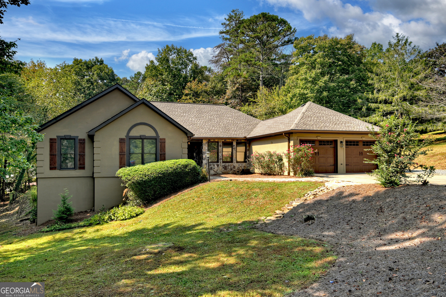 a front view of a house with a yard