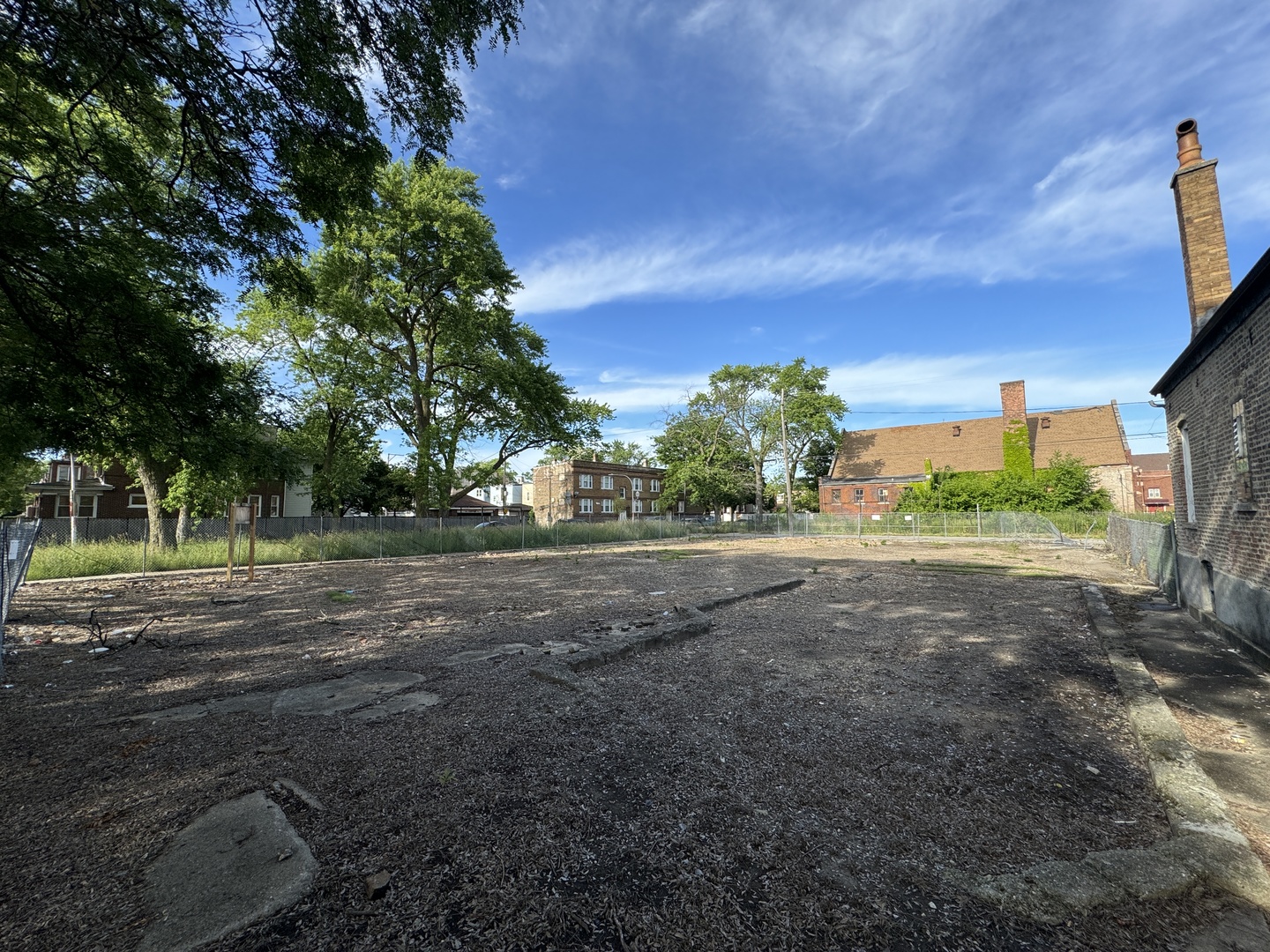 a view of outdoor space with trees all around