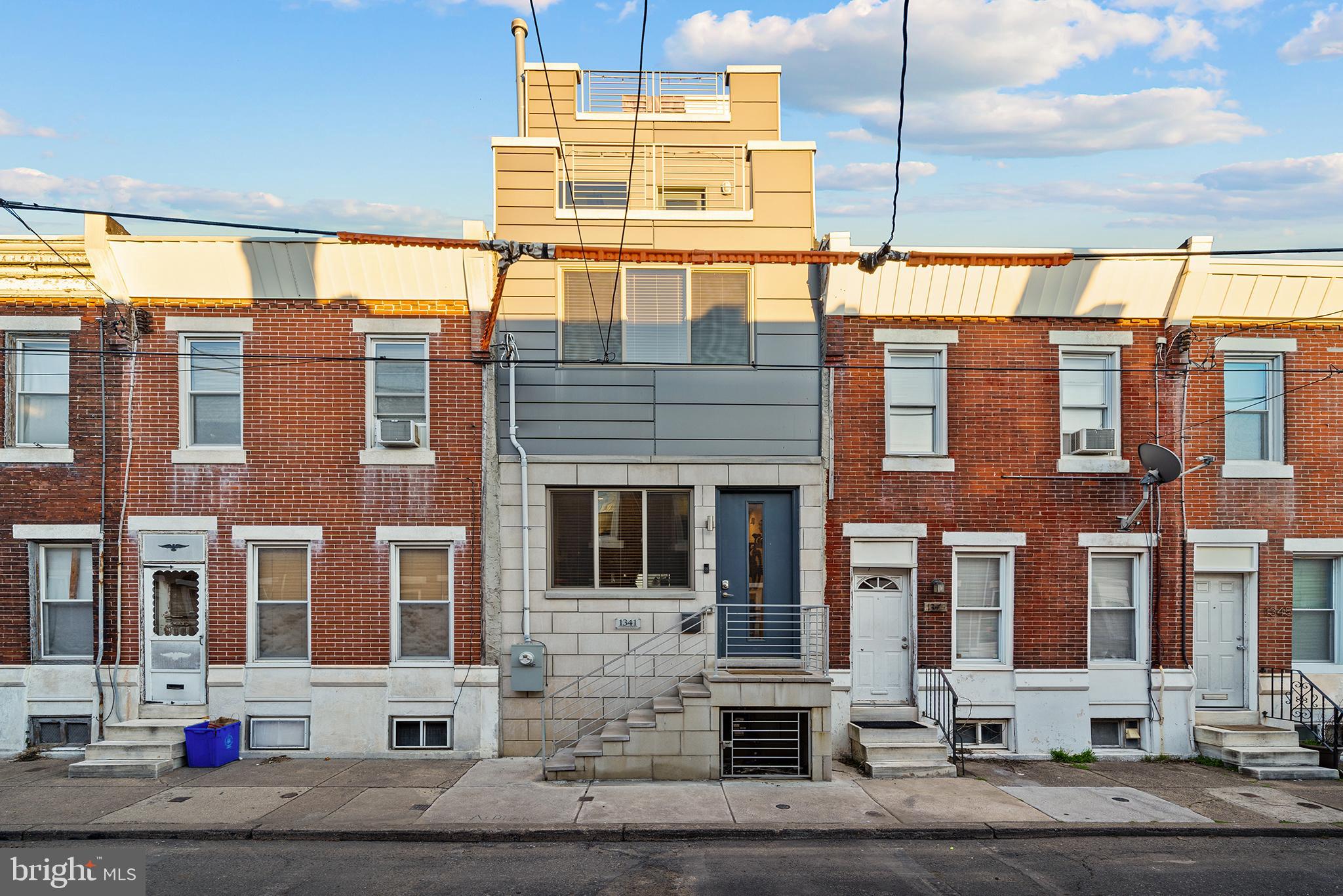 a front view of a building with street view