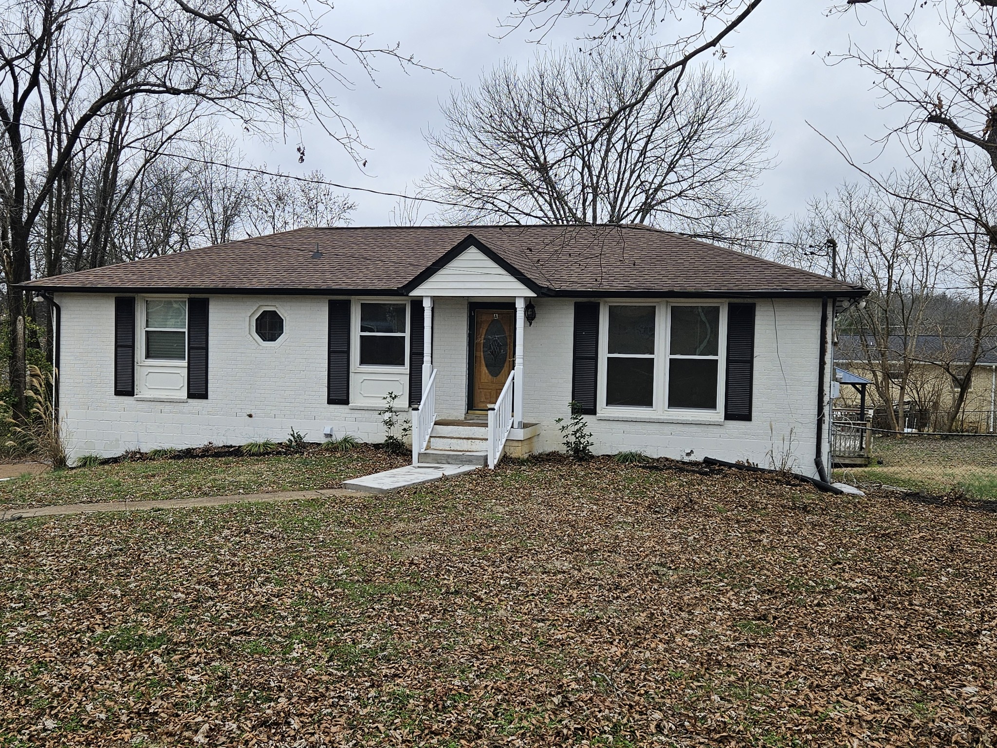 a house with trees in the background