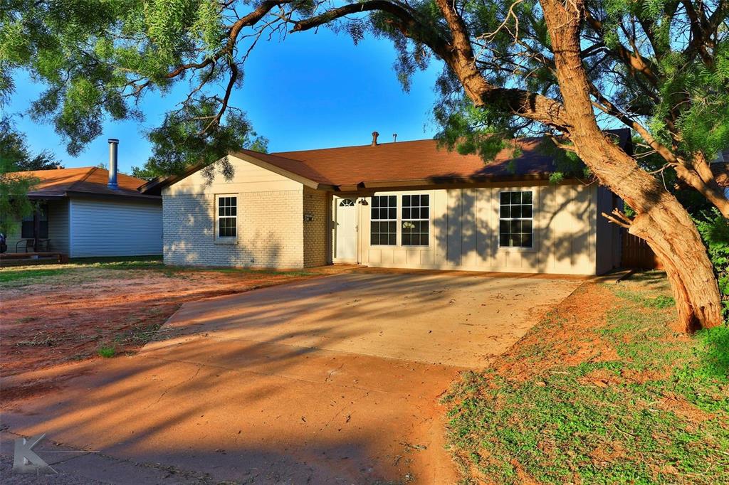 a house with trees in front of it