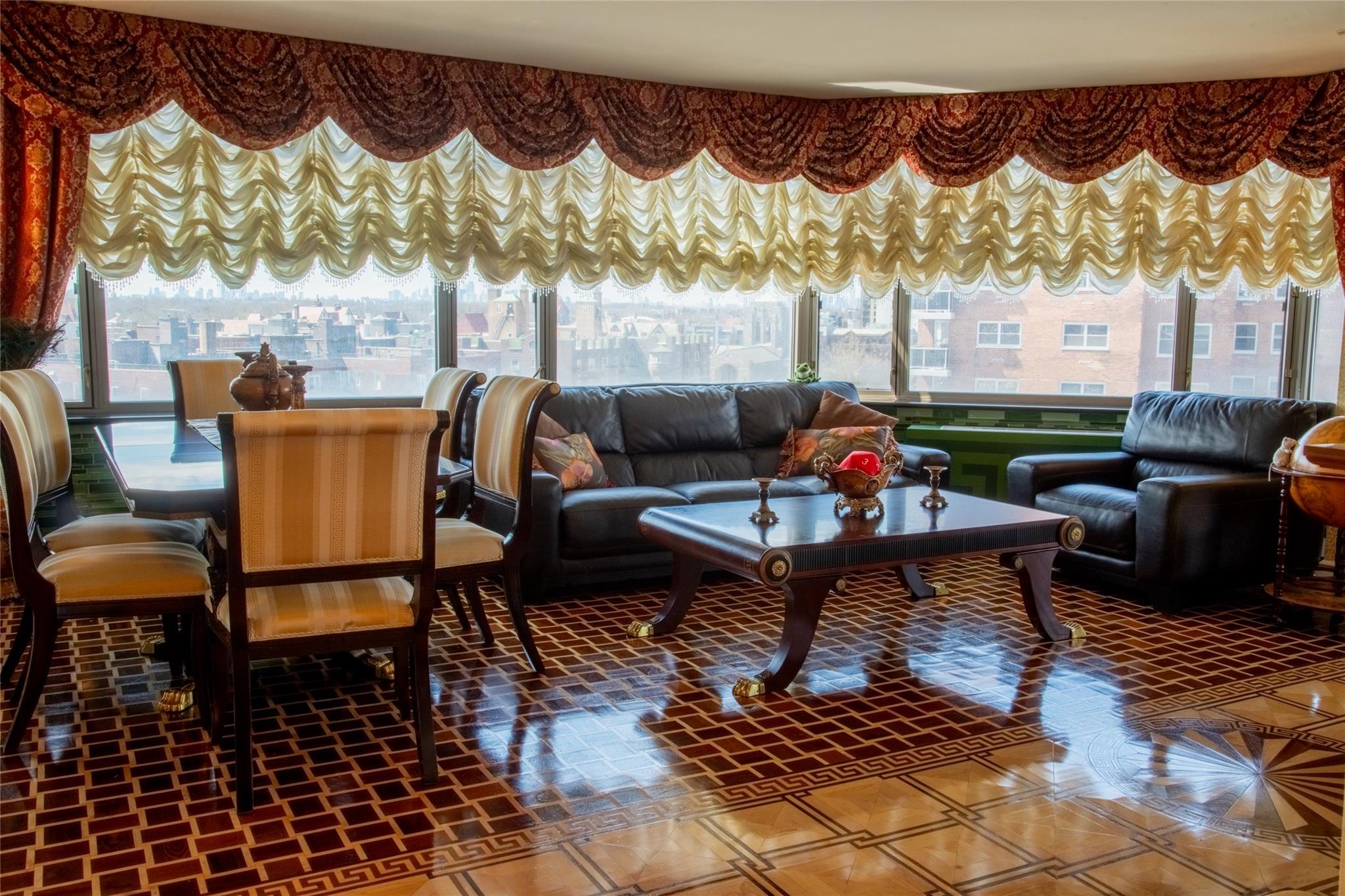 a reading room with furniture and a wooden floor