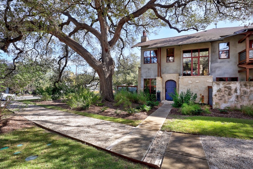 a front view of a house with garden