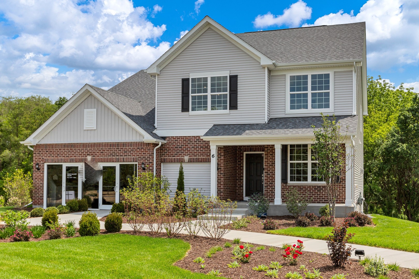 front view of a house with a yard