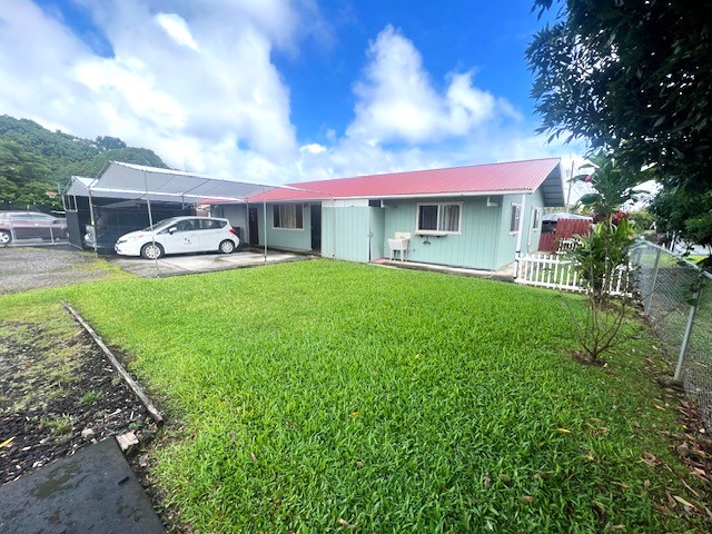 Front of Property - beautiful fenced yard with lots of grass.