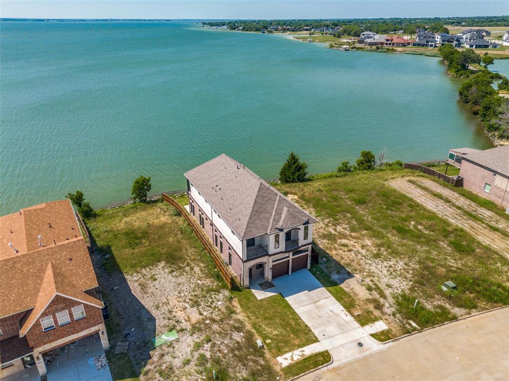 an aerial view of a house with a lake view