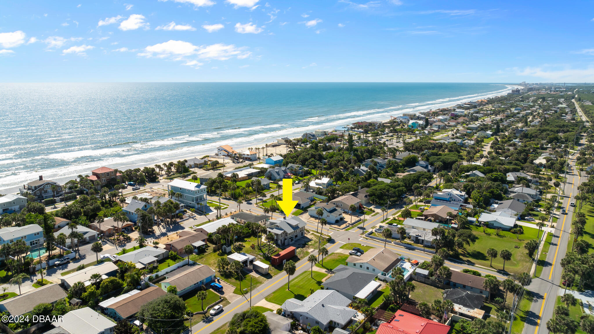 an aerial view of beach and ocean