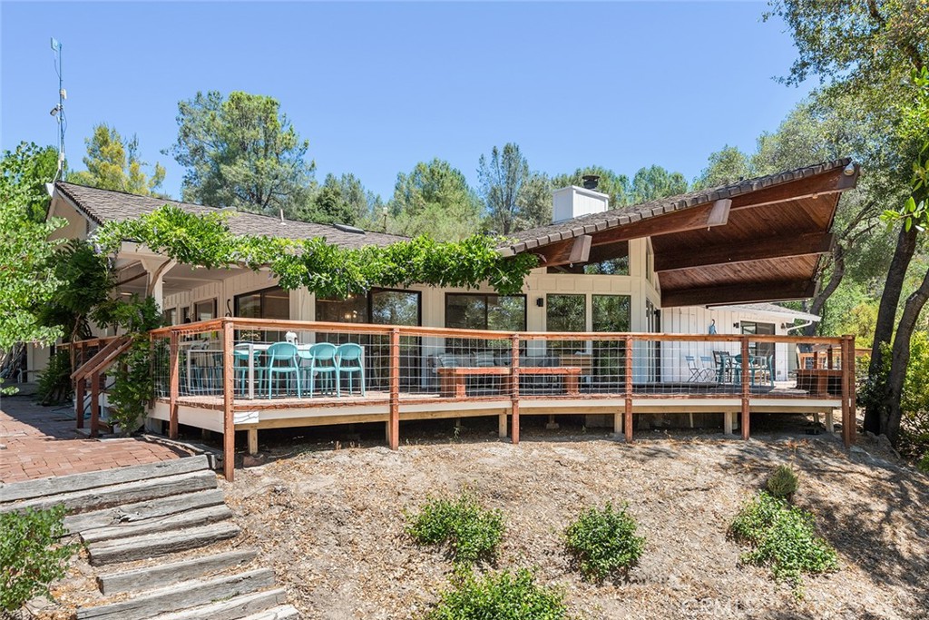 a view of a wooden deck with a yard