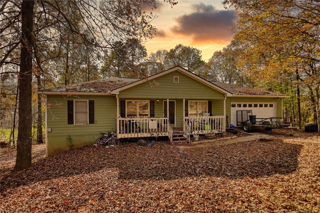 a front view of a house with sitting area