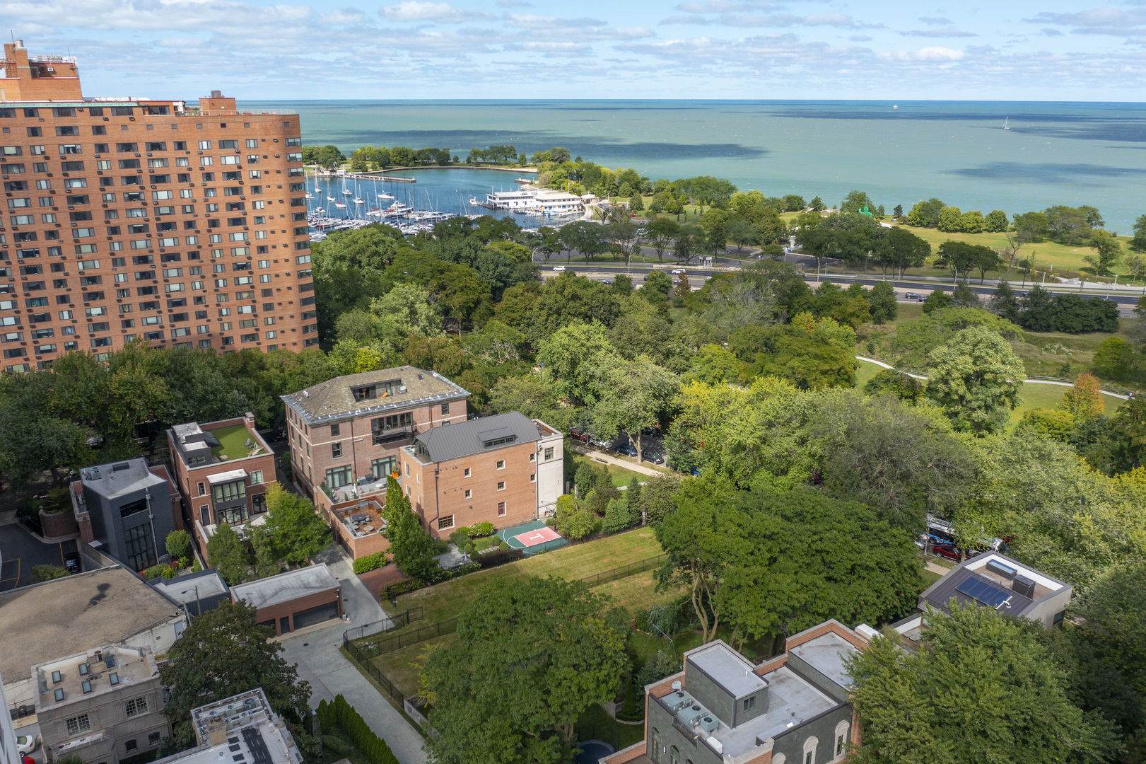 an aerial view of a house with a lake view