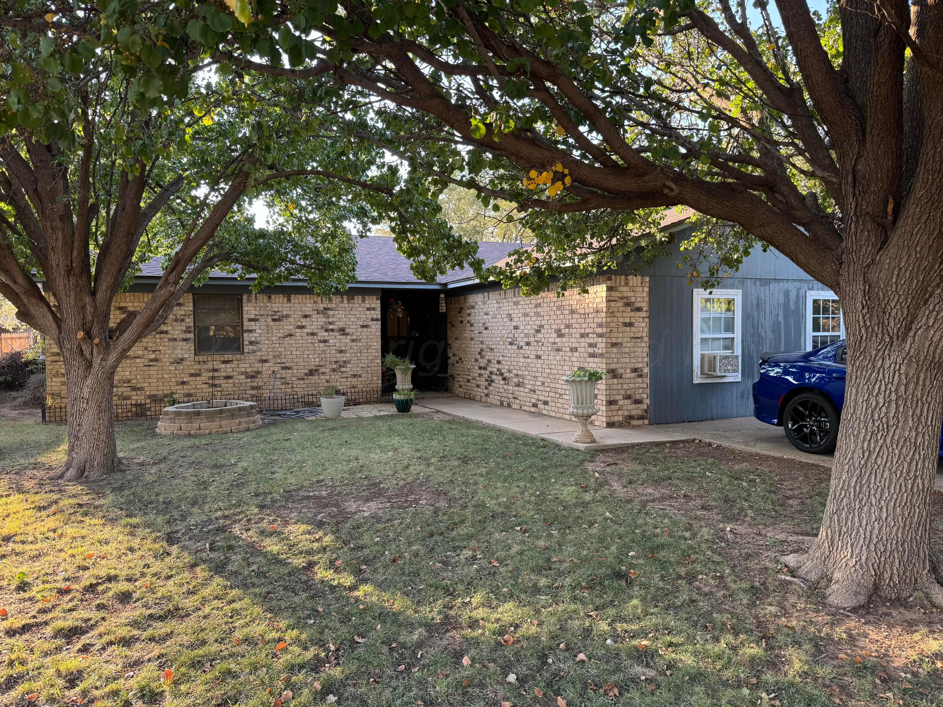 a view of a house with a tree