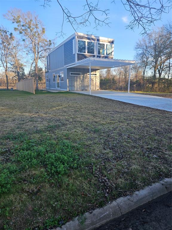 a view of house with yard