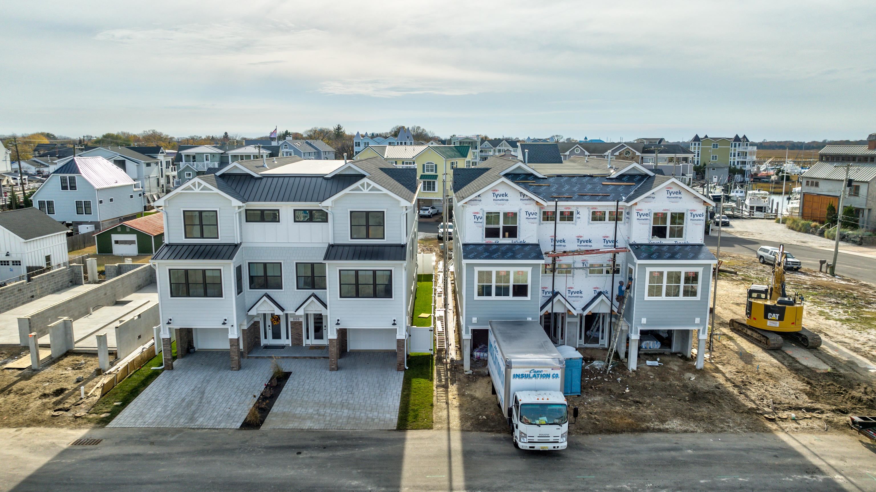 an aerial view of a residential apartment building with a yard