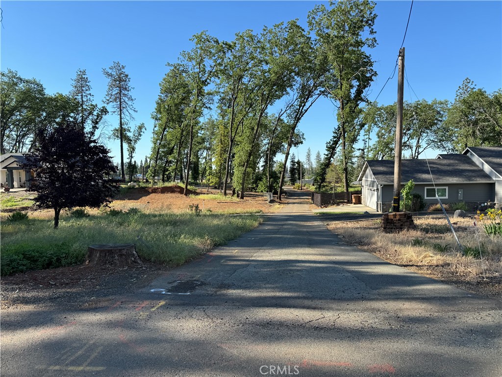 a view of street with houses and trees