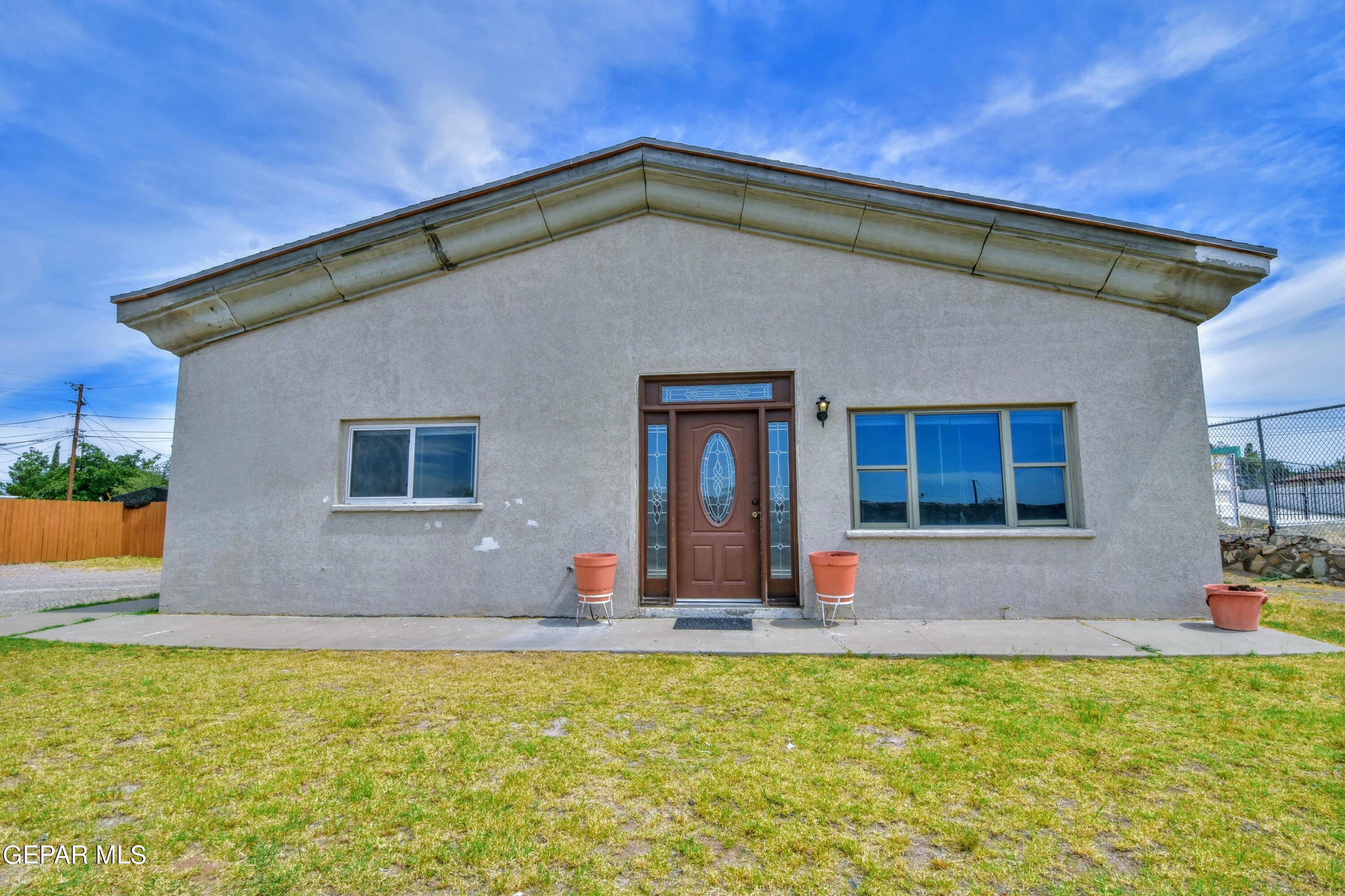 a front view of house with outdoor space