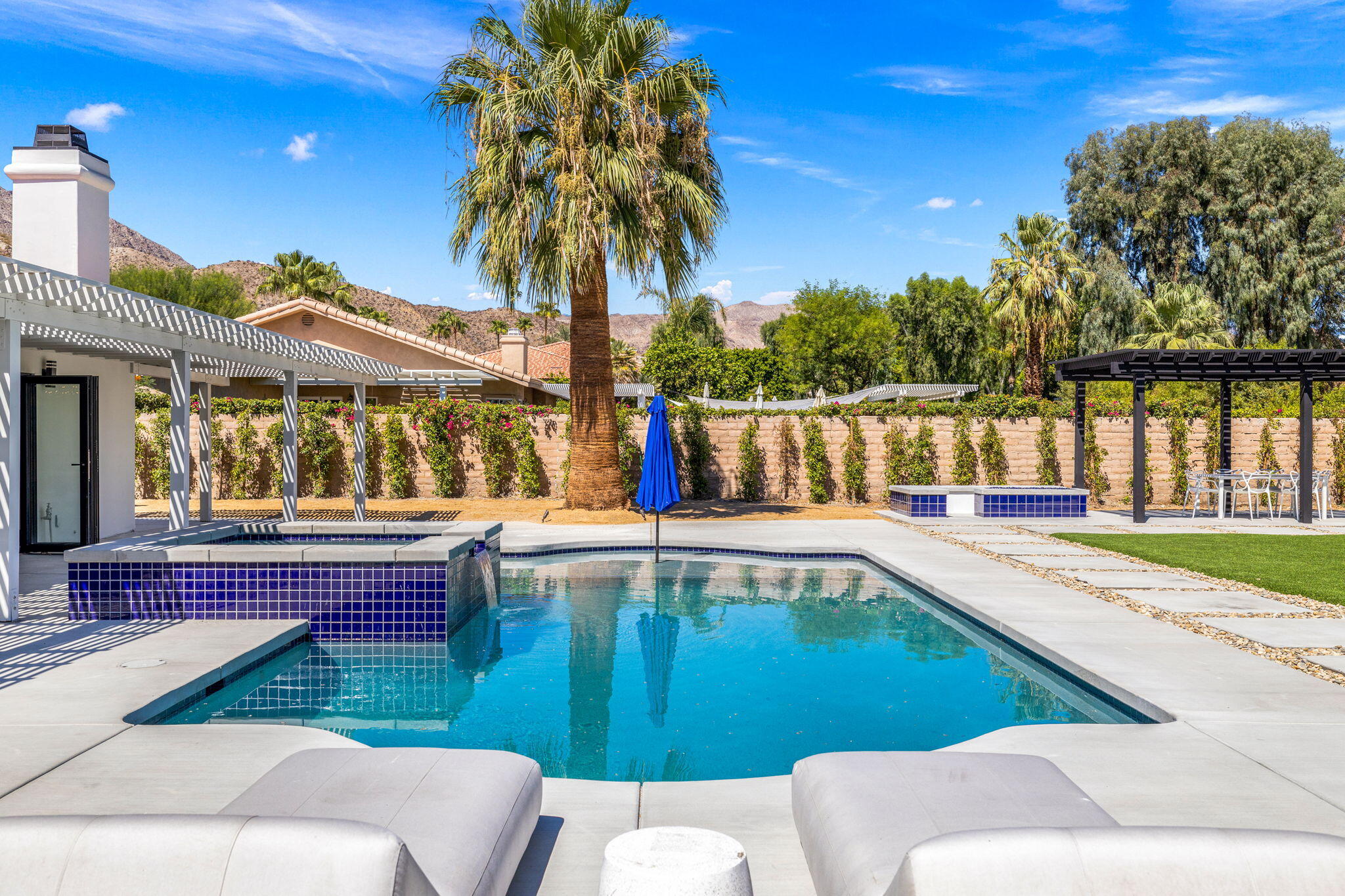 a view of a swimming pool with a patio