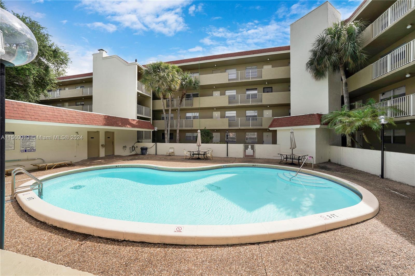 a view of a swimming pool with a sitting space