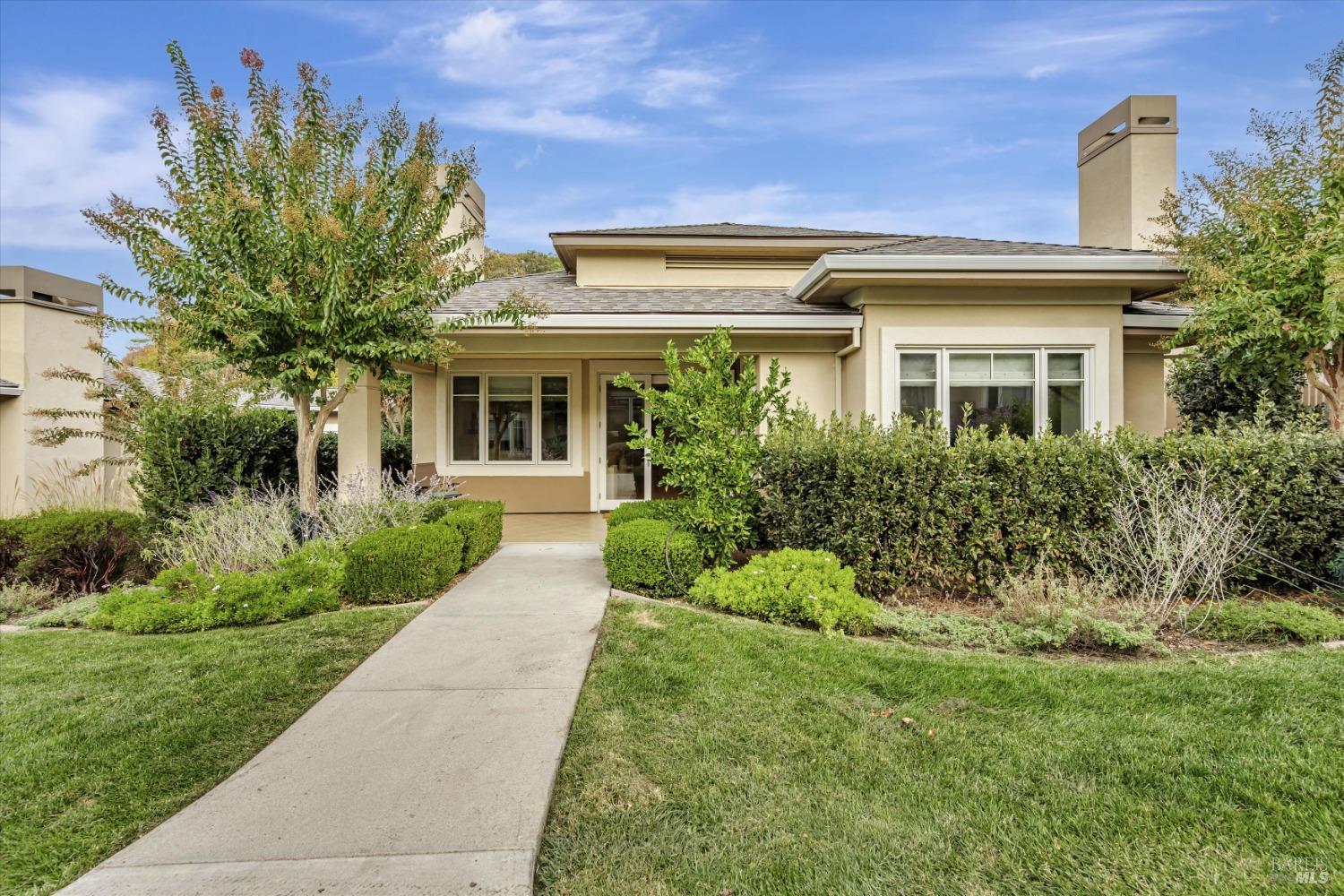 front view of a house with a yard