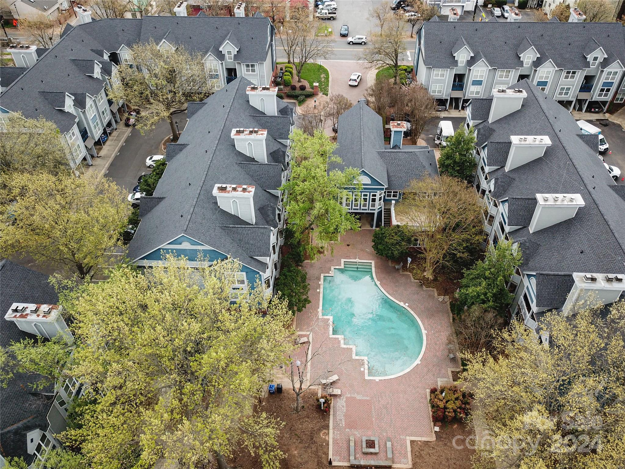 an aerial view of residential houses with outdoor space