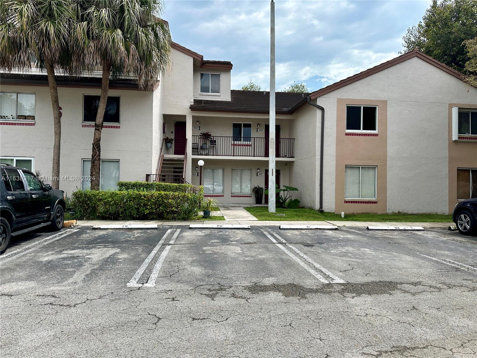 a house with a yard and parking space