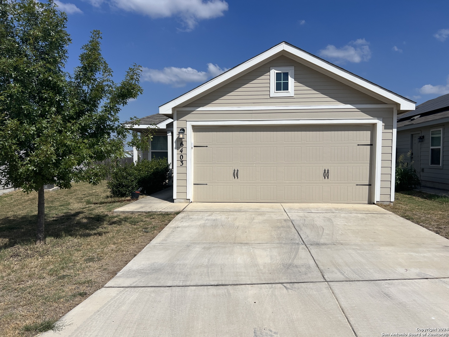 a front view of a house with a garage