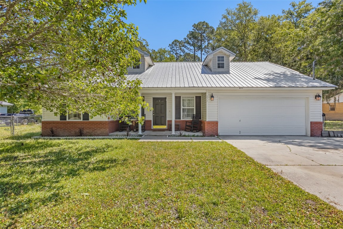 a front view of a house with yard