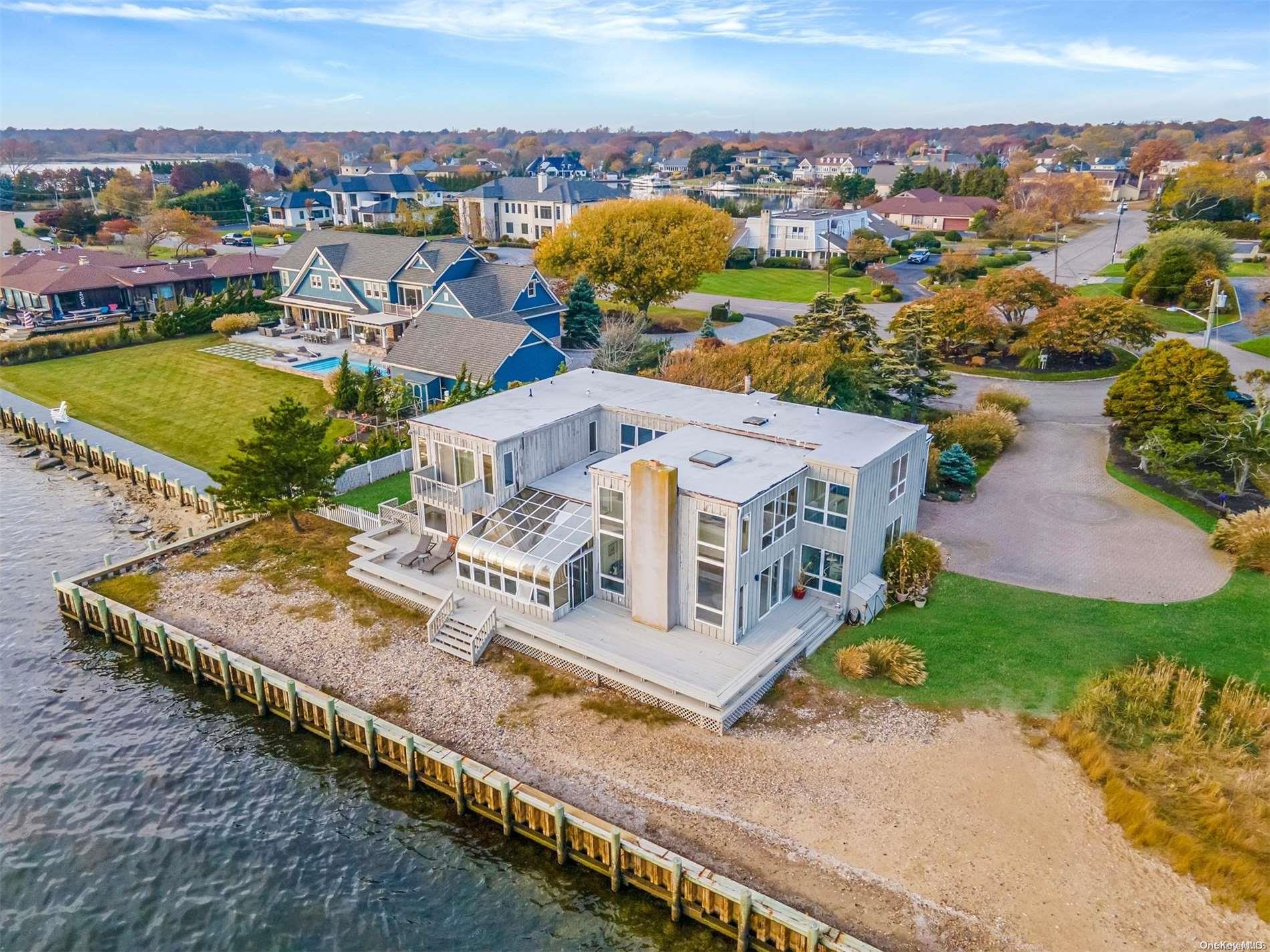 an aerial view of a house with a ocean view