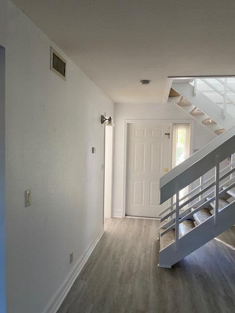 a hallway with wooden floor