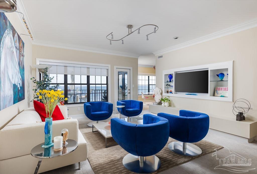 a living room with furniture and a flat screen tv