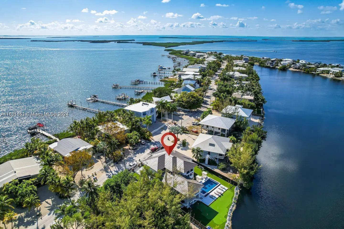 an aerial view of a house with a lake view