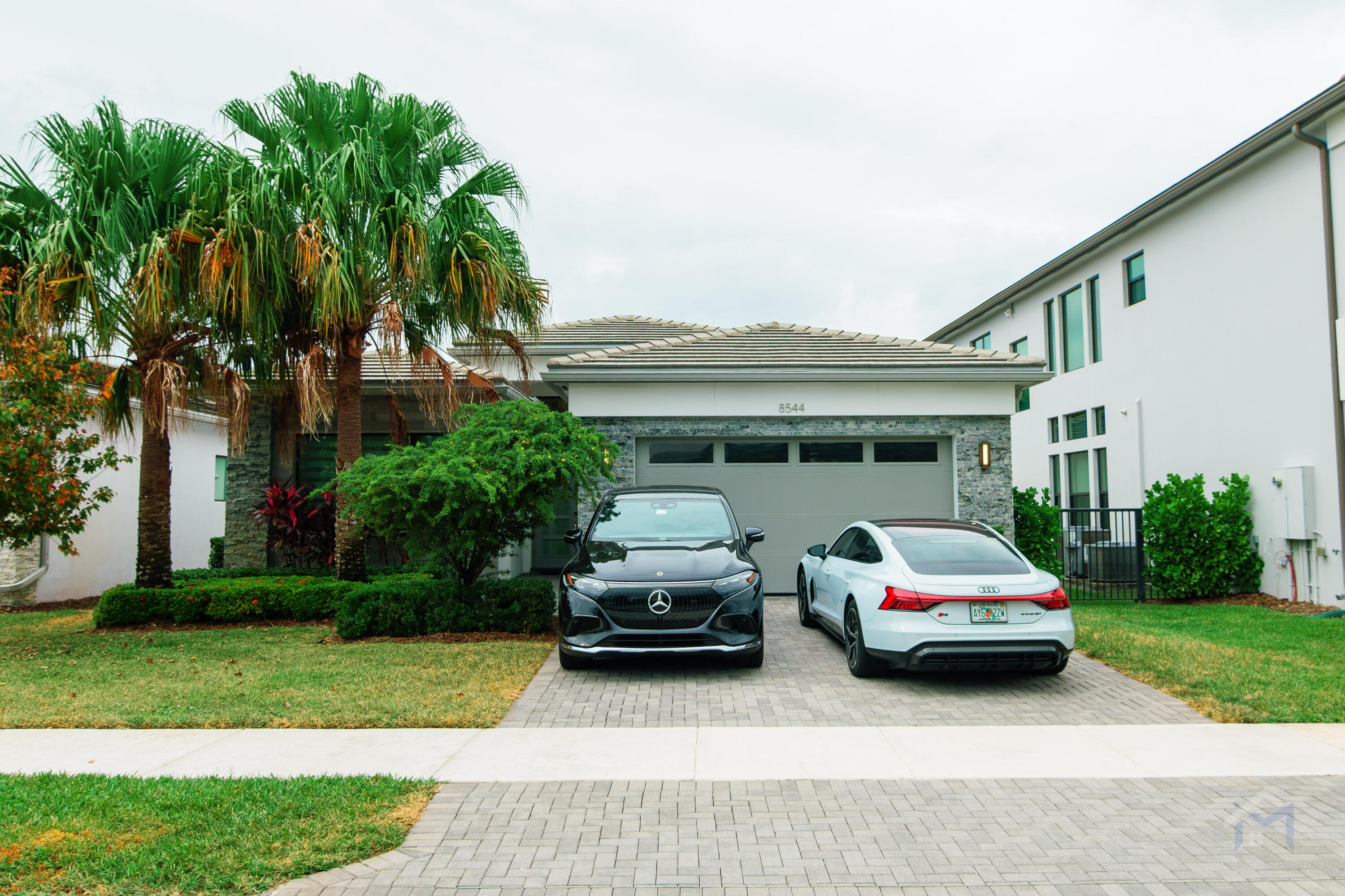 a car parked in front of a house with a car parked