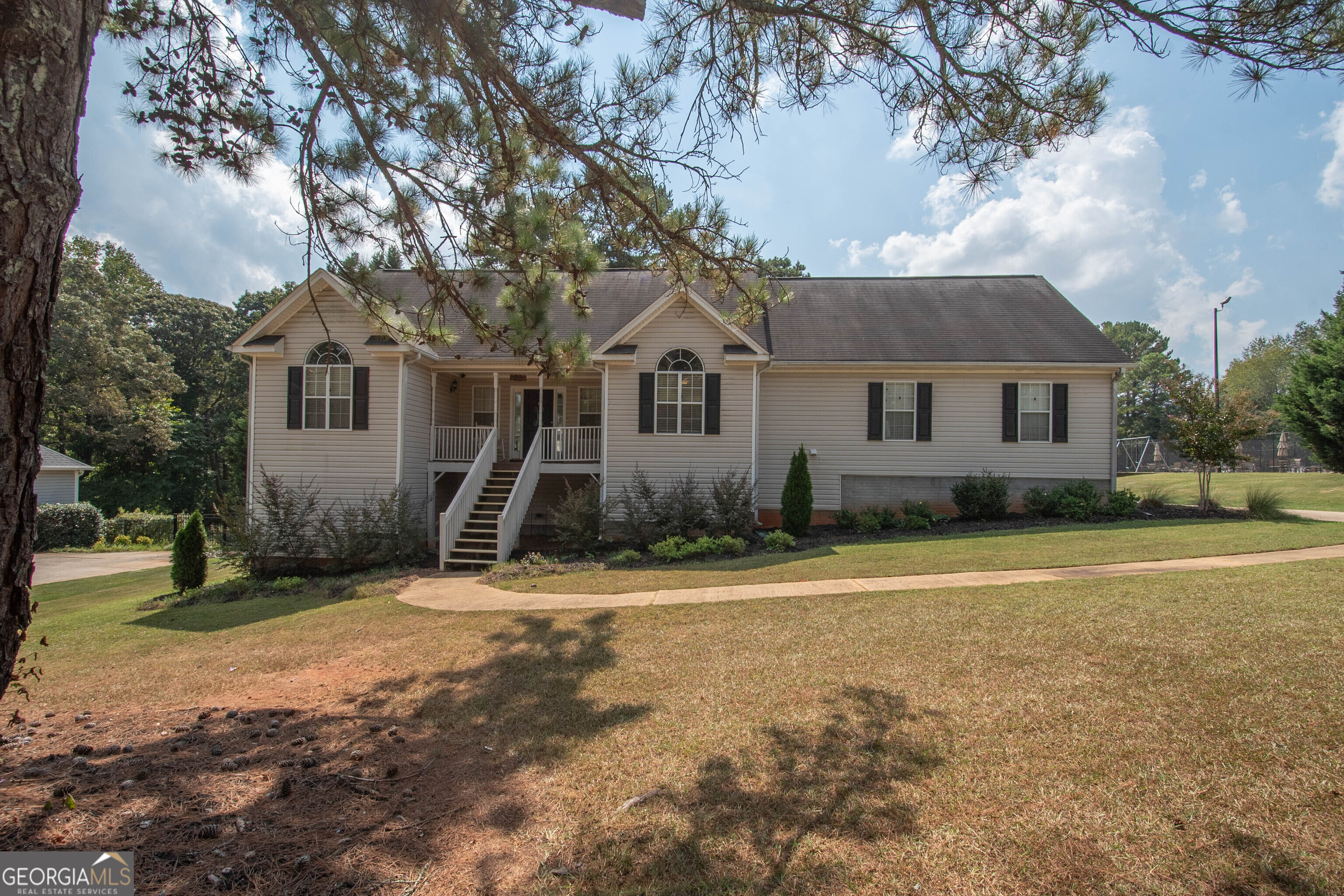 front view of a house with a yard