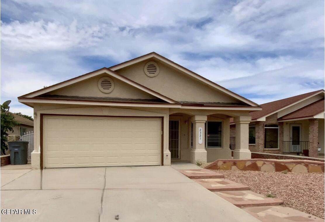 a front view of a house with a garage