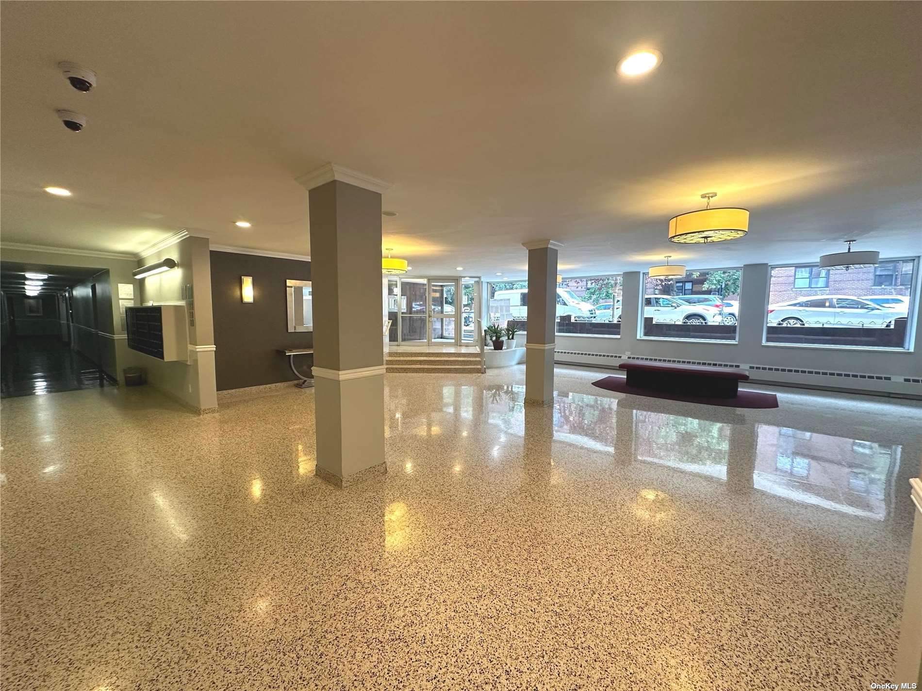 a view of a lobby with black carpet