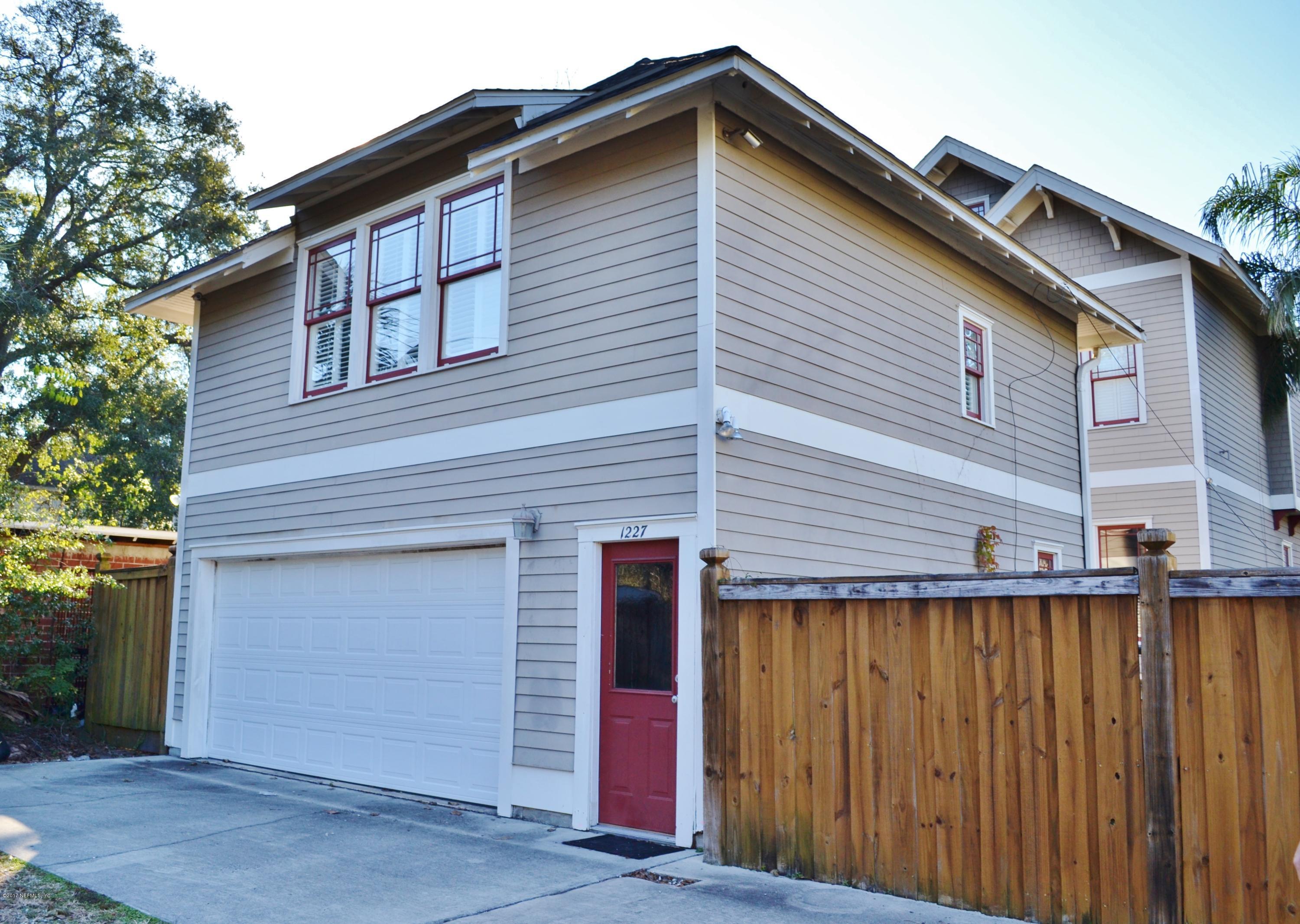 a front view of a house with a garage