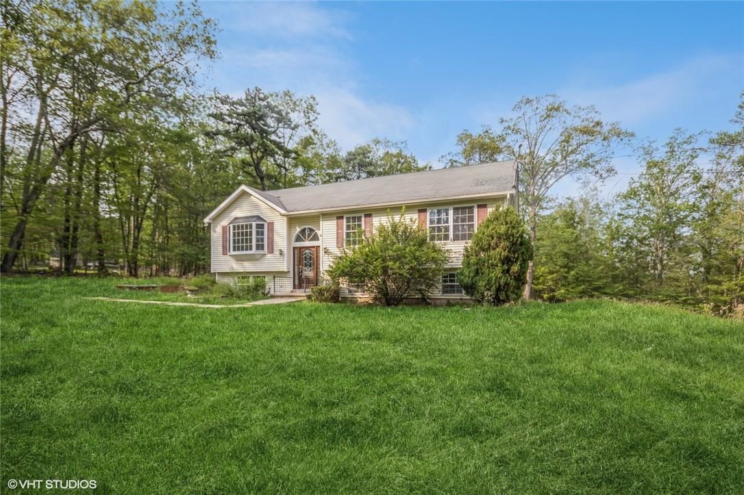 Split foyer home with a front lawn