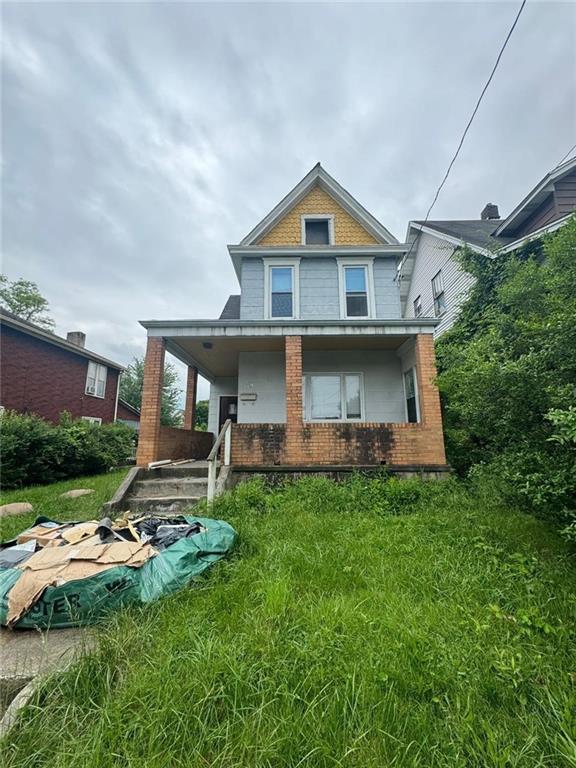 a front view of a house with a yard