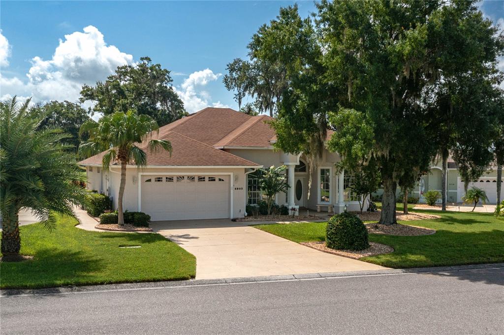 a house with trees in the background