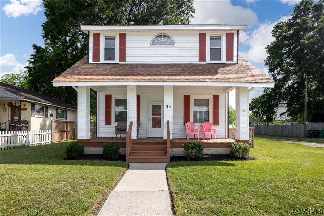 a front view of a house with an outdoor seating