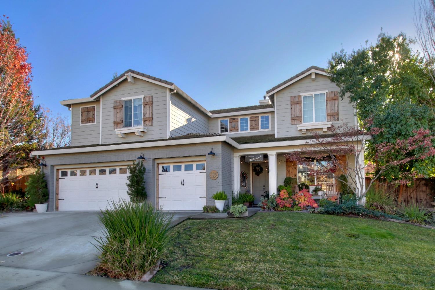 a front view of a house with garden