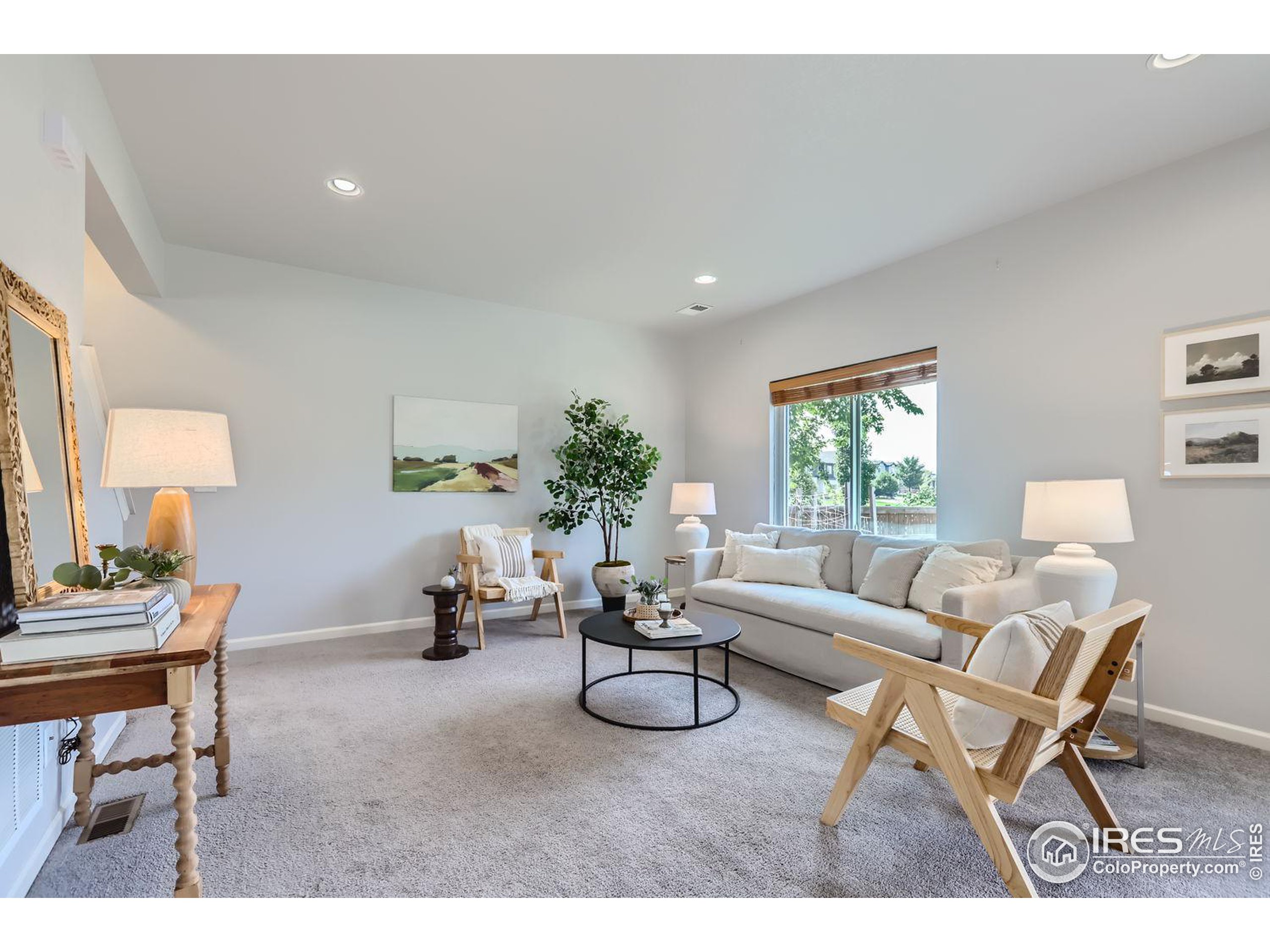 a living room with furniture and a table