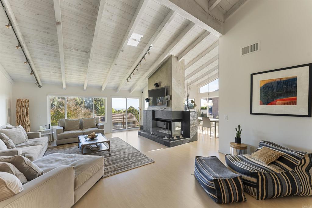 a living room with furniture fireplace and a fireplace