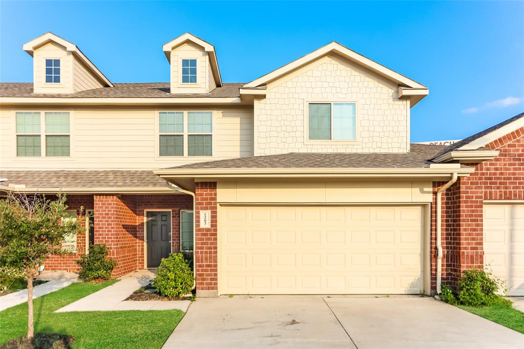 a front view of a house with a garage