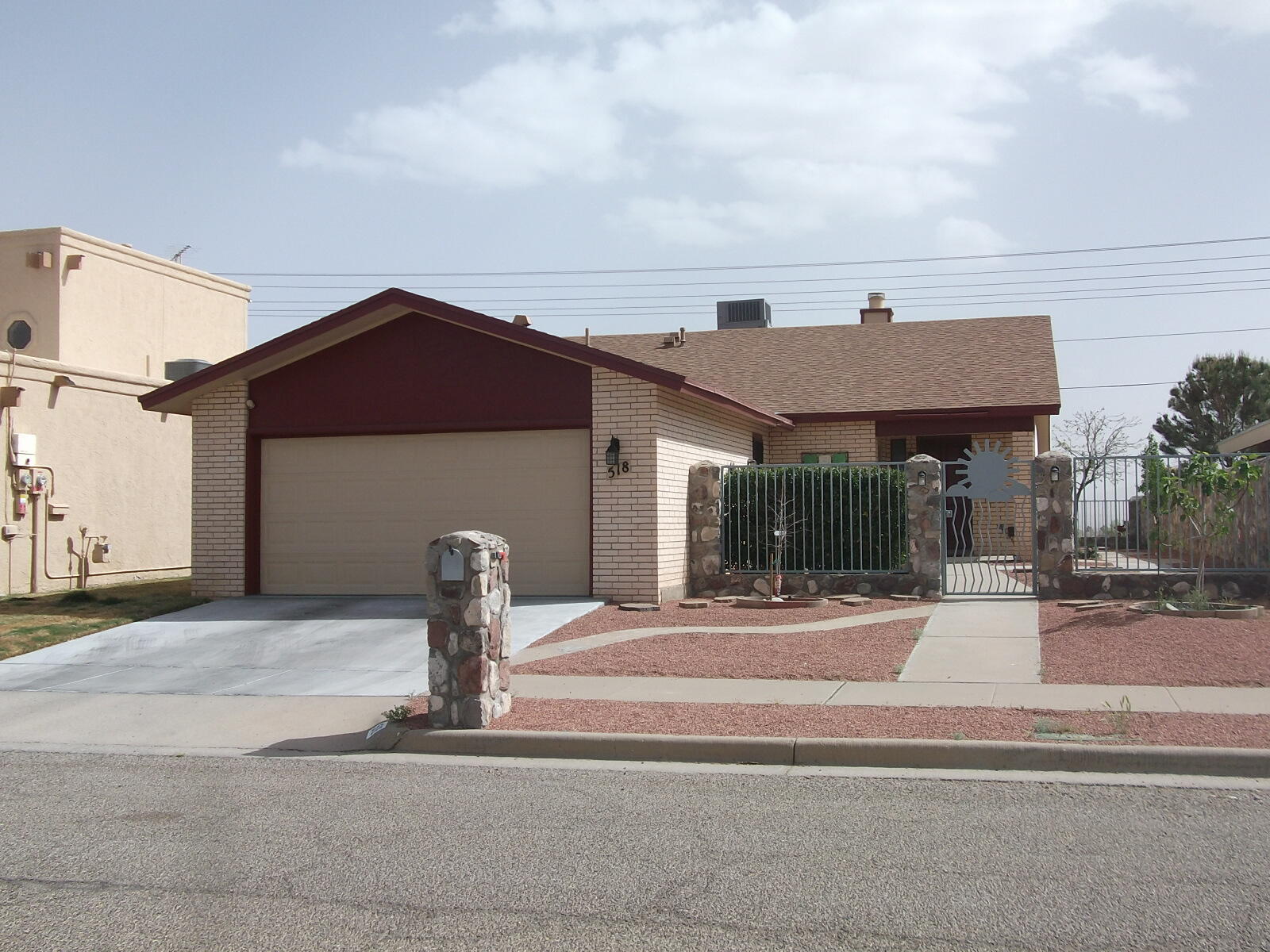 a front view of a house with garden