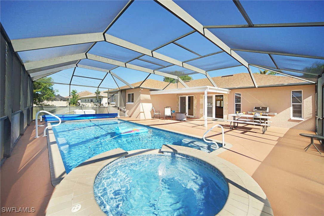 a view of a swimming pool with a patio