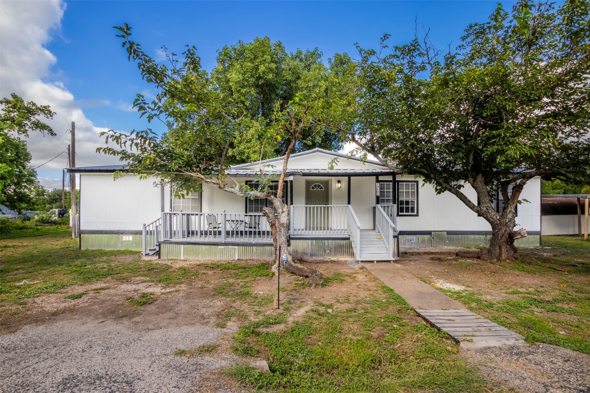 front view of a house with a yard